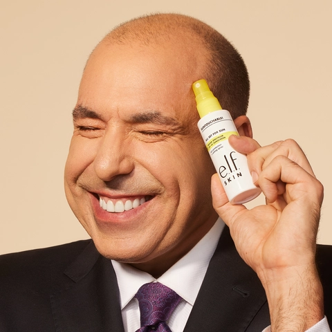 Rick Hoffman holding Suntouchable All Set for Sun SPF 45 in hand