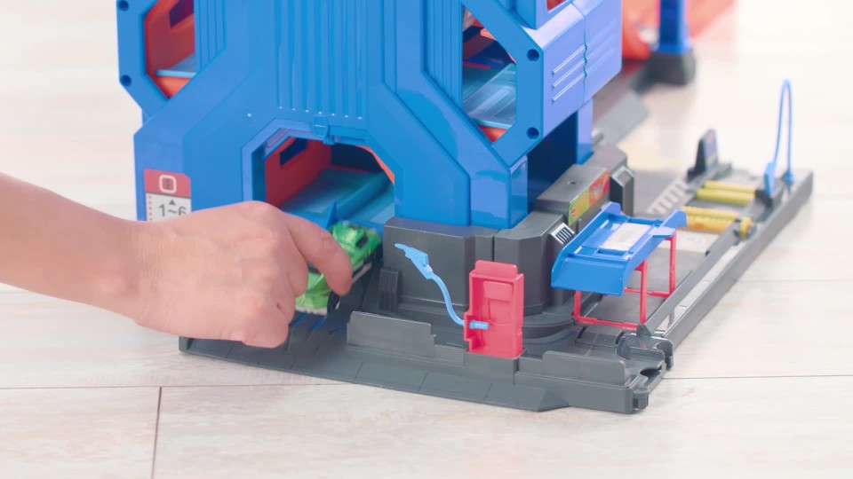 thumbnail video image 2 of Hot Wheels Mega Garage Toy Car Track & Playset, Stores 35+ 1:64 Scale Vehicles, 2 of 7