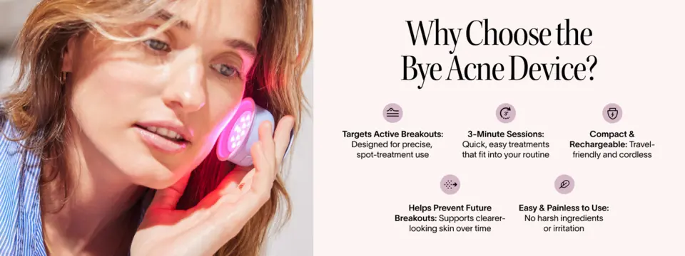 Person using a compact light therapy device on the face for spot treatment.