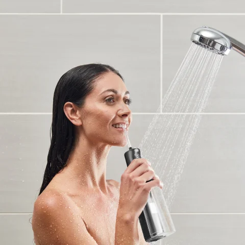 Using  Black Cordless Express Water Flosser WF-02 in Shower