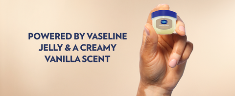 Hand holding a small pot of Vaseline Lip Therapy Jelly &amp; text about a creamy vanilla scent