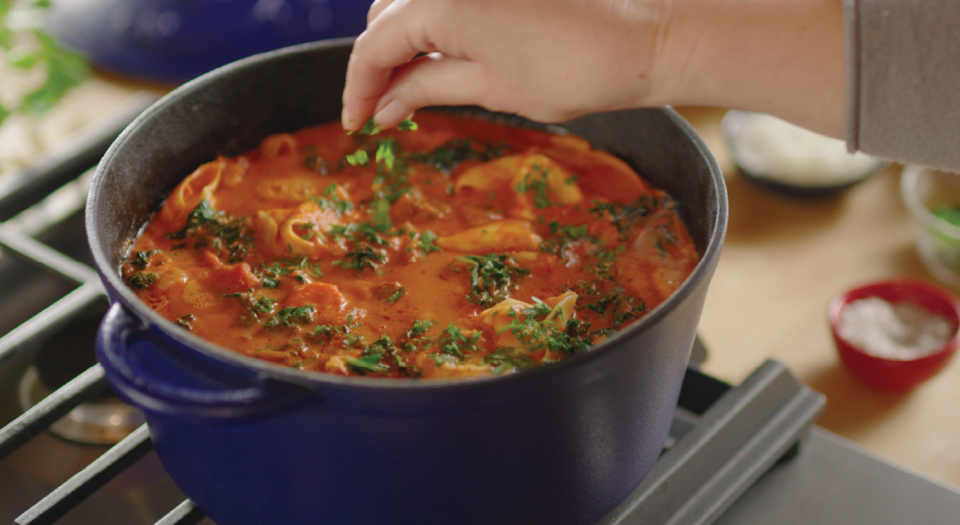 thumbnail video image 3 of Farberware Disney Bon Voyage 4.75 Quart Pre-Seasoned Cast Iron Dutch Oven with Lid, Induction Compatible, Metal Utensil, Broiler and Oven Safe to 500°F, Blue, 3 of 9