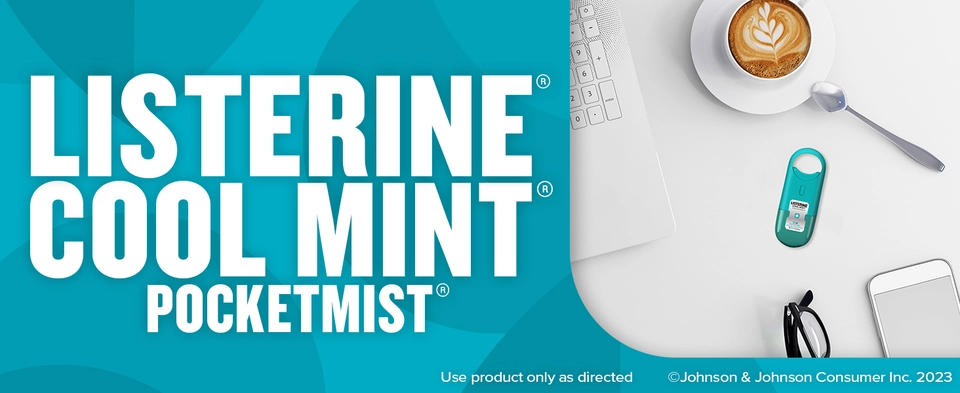 Listerine Cool Mint PocketMist sitting on a desk near a cup of coffee to tackle bad breath germs