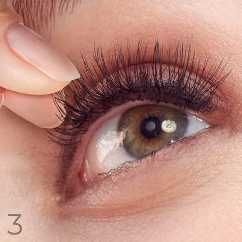 3. Once tacky, apply lash along natural lash line. Hold, allowing adhesive to dry completely.