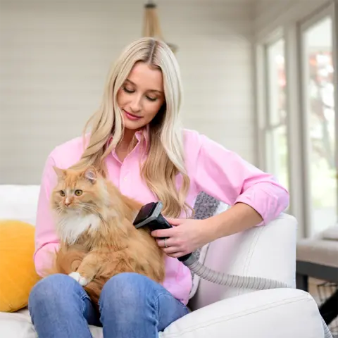 Professional PLUS Deshedding Tool used on a cat