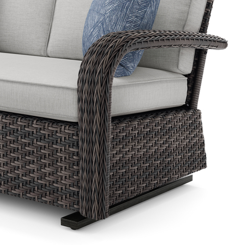 Nogales Glider detail view of wicker arm and glider base