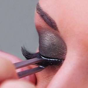 Place and hold strip lash until adhesive dries