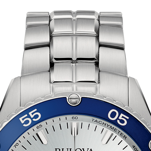 close-up image of stainless steel bracelet and blue bezel