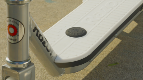 A close up image showing a pressure sensor on the deck of a scooter