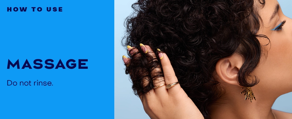 Image of a woman massaging her hair with product.