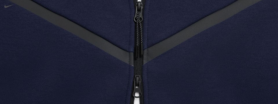 Zippered chest detail of Nike hoodie with contrasting grey accents.