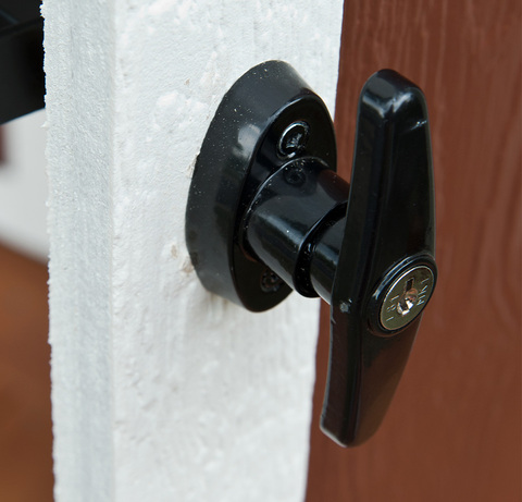 Close up of heavy duty locking handle on front of the door.