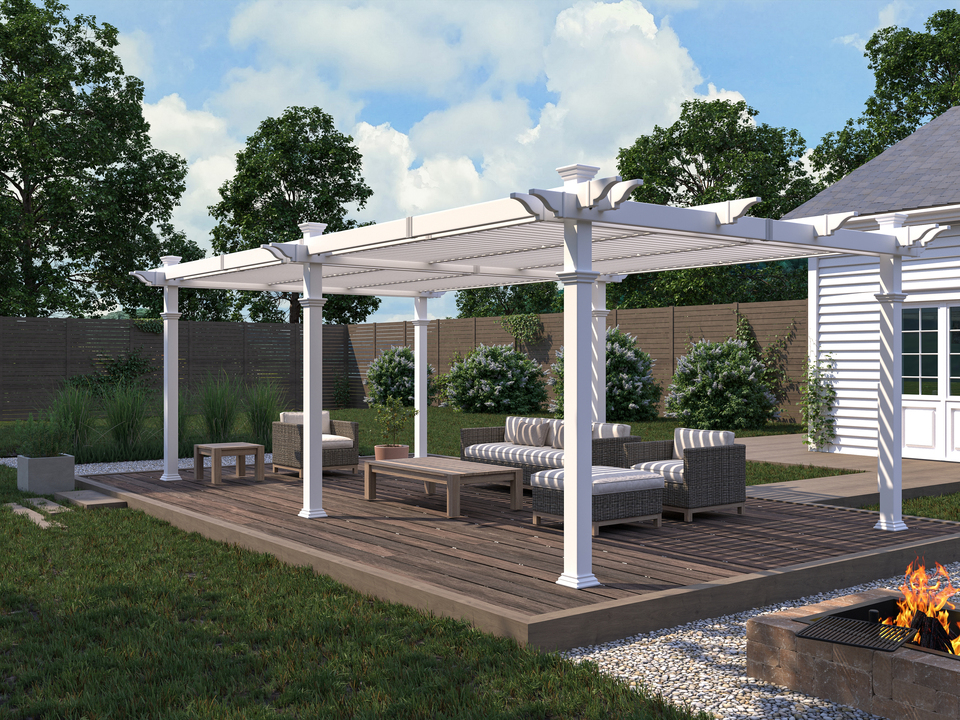 White pergola on a wooden deck with a seating area underneath