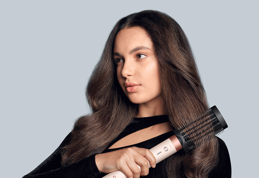 Model using Dyson Airwrap Co-anda2x with the Anti-snag loop brush 2x attachment