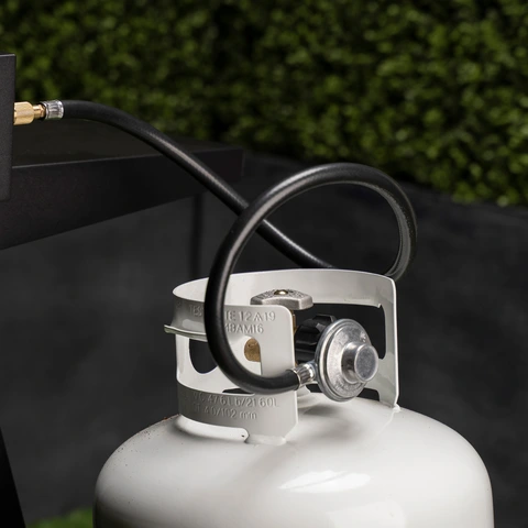 Bulk liquid propane tank adapter hose shown in use. 