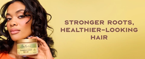 Image of a young black woman with wavy hair holding a pot of SheaMoisture Masque, next to text.