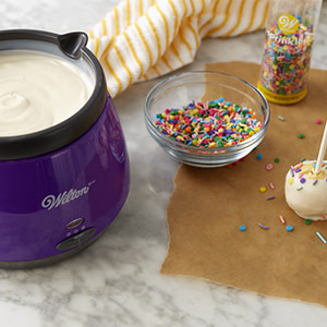 Wilton Cake Decorating - A melting pot that's easy to clean? You bet!  Wilton Candy Melts™ Candy Melting Pot has a silicone pot. When you're done,  just let the melted candy harden