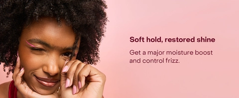 Image of a woman with curly hair, next to text highlighting benefits of our hydration mist.