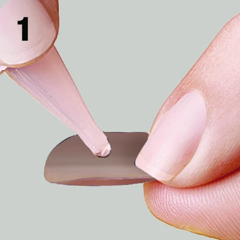 1. Apply glue to back of artificial nail.