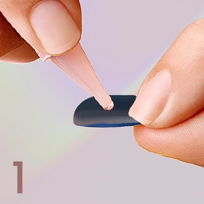 1. Apply glue to the back of artificial nail.