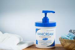 a jar of Vanicream Moisturizing Cream sits on a counter-top. This jar contains the iconic blue pump-top.