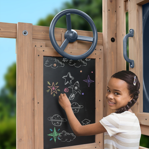 Child playing with chalkboard on Skyline Lookout