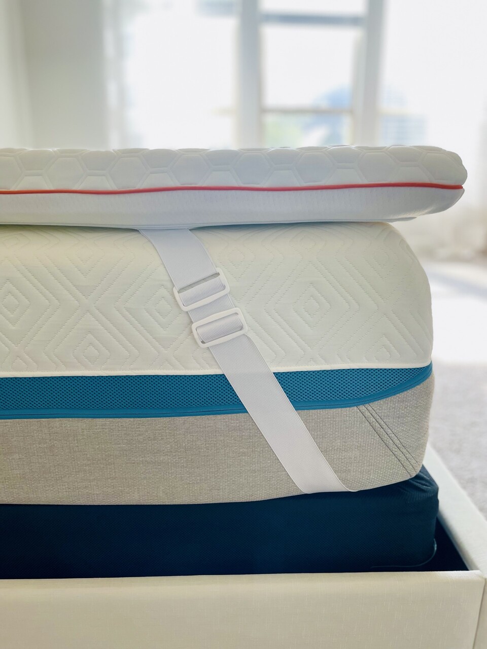 Adjustable Stay-Put straps that keep the topper snuggly in place on the mattress.