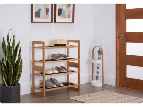 two bamboo shoe rack stacked together in an entry way