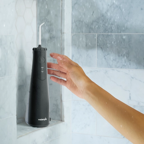 Black Cordless 1100 Water Flosser WF-30CD012 in Shower