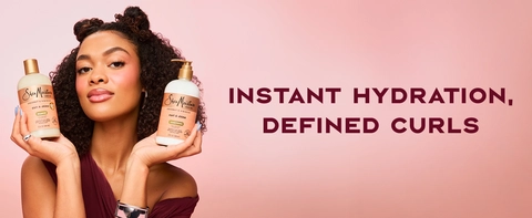 Image of a young woman with curly hair and buns, next to text: instant hydration, defined curls.