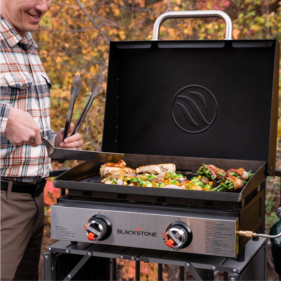 A small family cooking on a 22 inch tabletop griddle