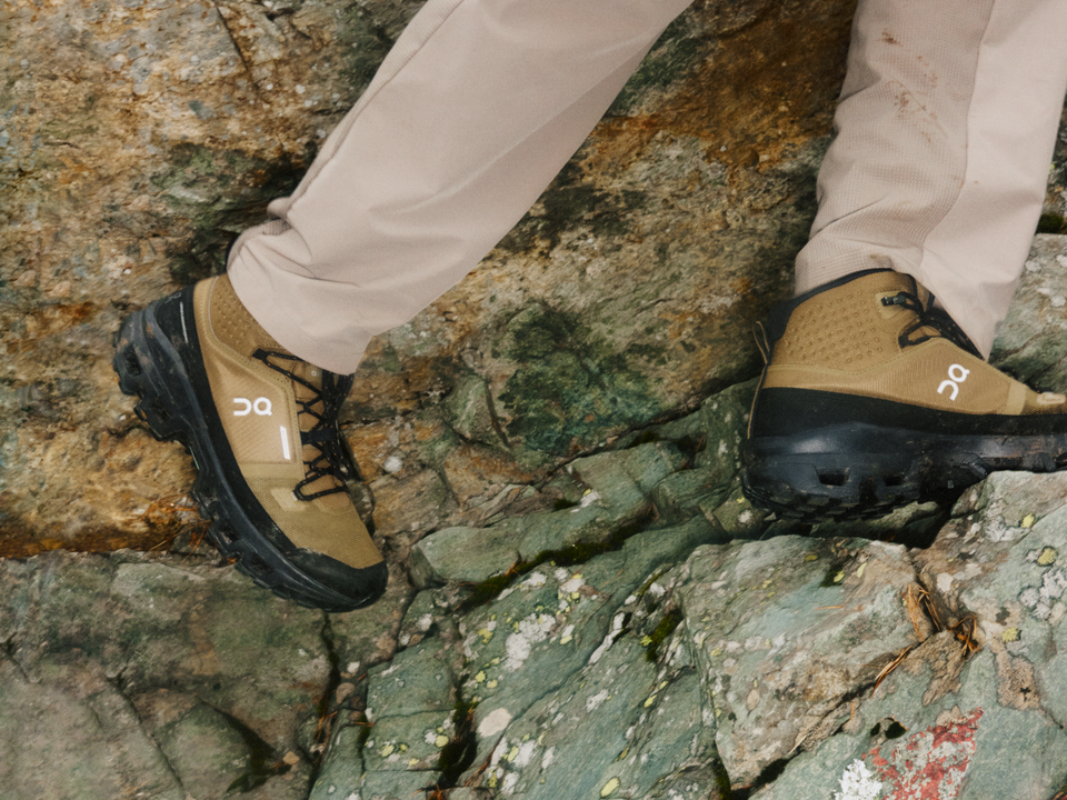 On Cloudrock waterproof hiking boots on mountain trail