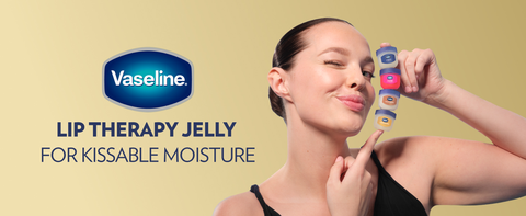 Image of a woman holding 4 small pots of Vaseline Lip Therapy Jelly, each of one kind.
