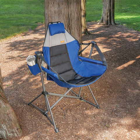 Swing chair in lightly wooded area.