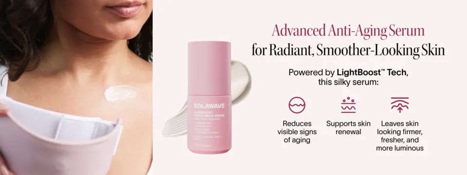 Woman applying Solawave LightBoost Face &amp; Neck Serum to neck with product bottle shown.