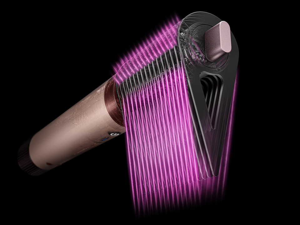 Pink graphics show the airflow through the Tension comb 2x attachment.