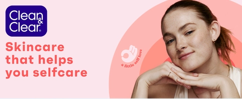  young woman smiling with  great skin using Clean &amp; Clear dual action moisturizer