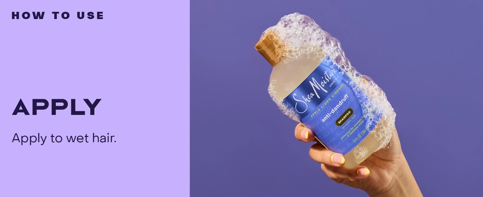 Image of a hand holding our shampoo.