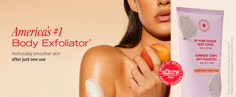 Model with swipe of scrub on arm holding a peach for peach scented scrub