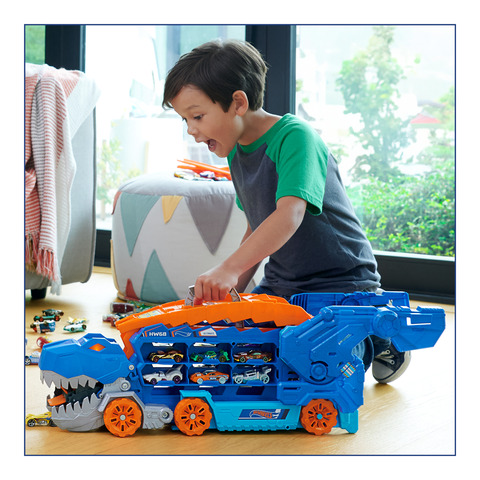 Hot Wheels City Ultimate Hauler, Transforms into a T-Rex with Race Track,  Stores 20+ Cars, 4Y+, Blue 