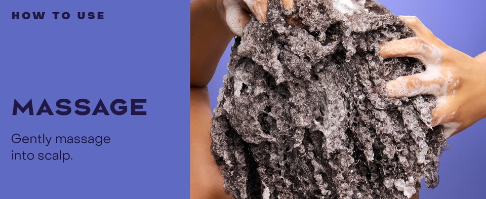 Image of a woman massaging her hair with product.