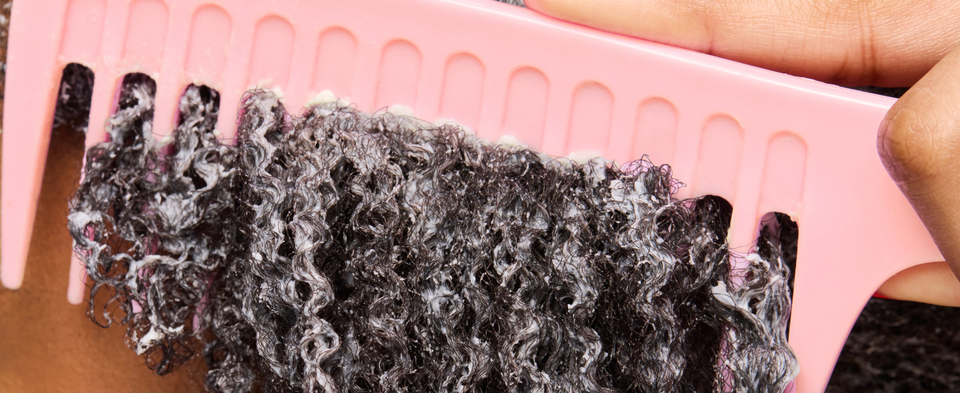 Image of a woman's hand combing wet curly hair, next to leave on hair instructions.