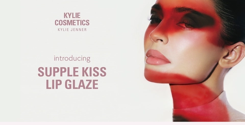 Visual Features Kylie Jenner wearing supple kiss lip glaze    Caption Reads:   KYLIE COSMETICS   KYLIE JENNER   introducing SUPPLE KISS LIP GLAZE