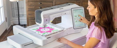 Woman embroidering using the 10 in x 10 in Magnetic Frame