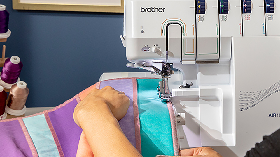 thumbnail video image 5 of Brother AIR1800 Air Serger with Jet Air Threading, 2/3/4 Thread, LED Lit Work Area, Plus Wide Table Extension and 4-Piece Thread Cones Starter Pack, 5 of 9