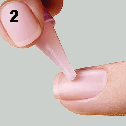 2. Apply glue to natural nail.