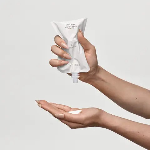 Empty Step 2: silk rinse packette into hands.