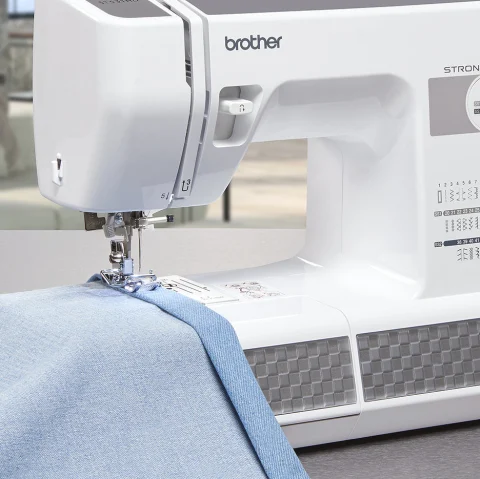 sewing a blue fabric 