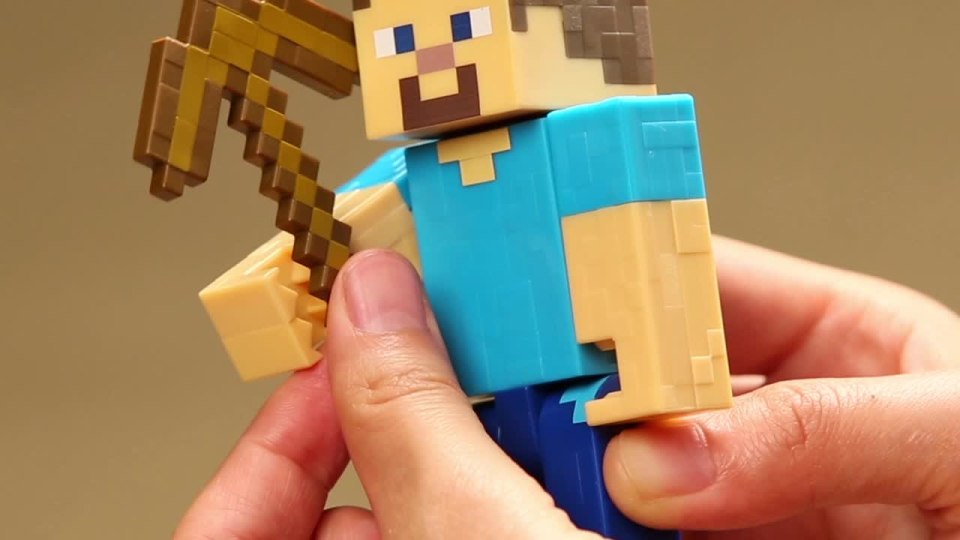 thumbnail video image 2 of Minecraft Steve With Pickaxe Basic Figure, 2 of 6