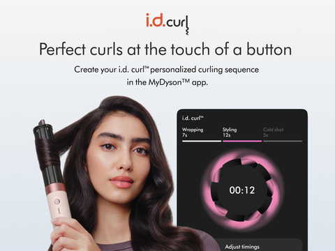 Model curls her hair in front of a screen showing the ID curl personalised curling sequence.